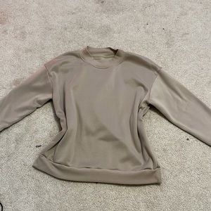Small greyish-brown crewneck.